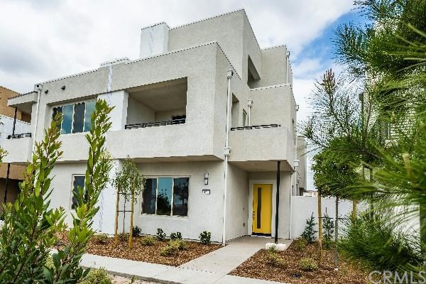 146 Spectacle Irvine, CA 92618 - Photo 3 of 57 a front view of a house with garden