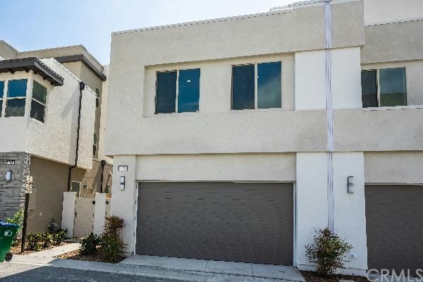 146 Spectacle Irvine, CA 92618 - Photo 4 of 57 a front view of a house with a yard