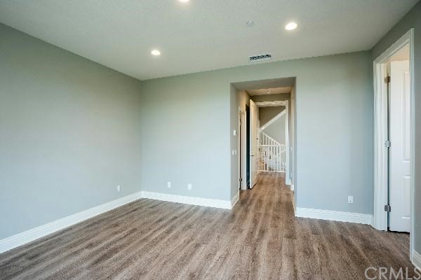 146 Spectacle Irvine, CA 92618 - Photo 43 of 57 wooden floor in an empty room with wooden floor
