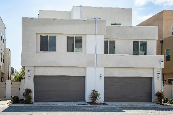 146 Spectacle Irvine, CA 92618 - Photo 5 of 57 a front view of a house with yard