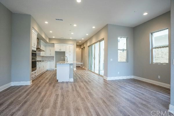 146 Spectacle Irvine, CA 92618 - Photo 7 of 57 a view of kitchen with cabinets and wooden floor