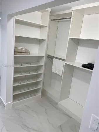 a bathroom with double sink and a mirror