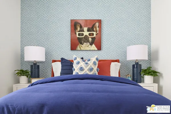 a bedroom with a bed and a painting on the wall