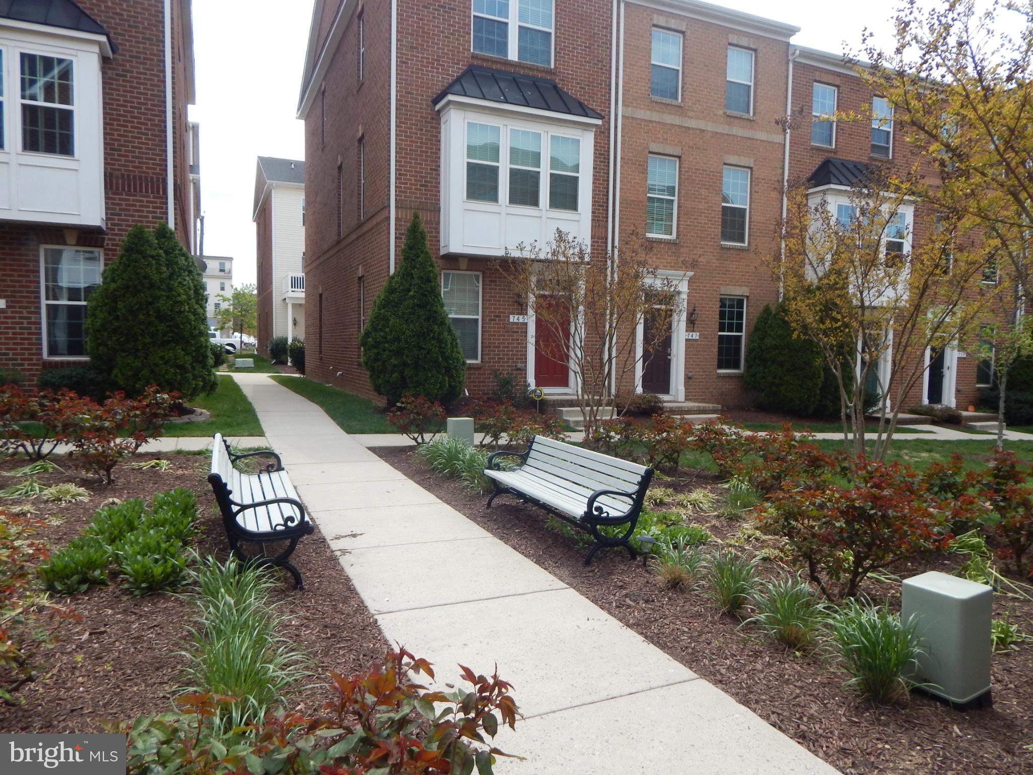 709 South Macon Street Baltimore, MD 21224 - Photo 7 of 8 a view of a building with garden and sitting area