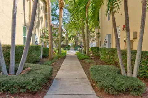a view of a pathway with a big yard