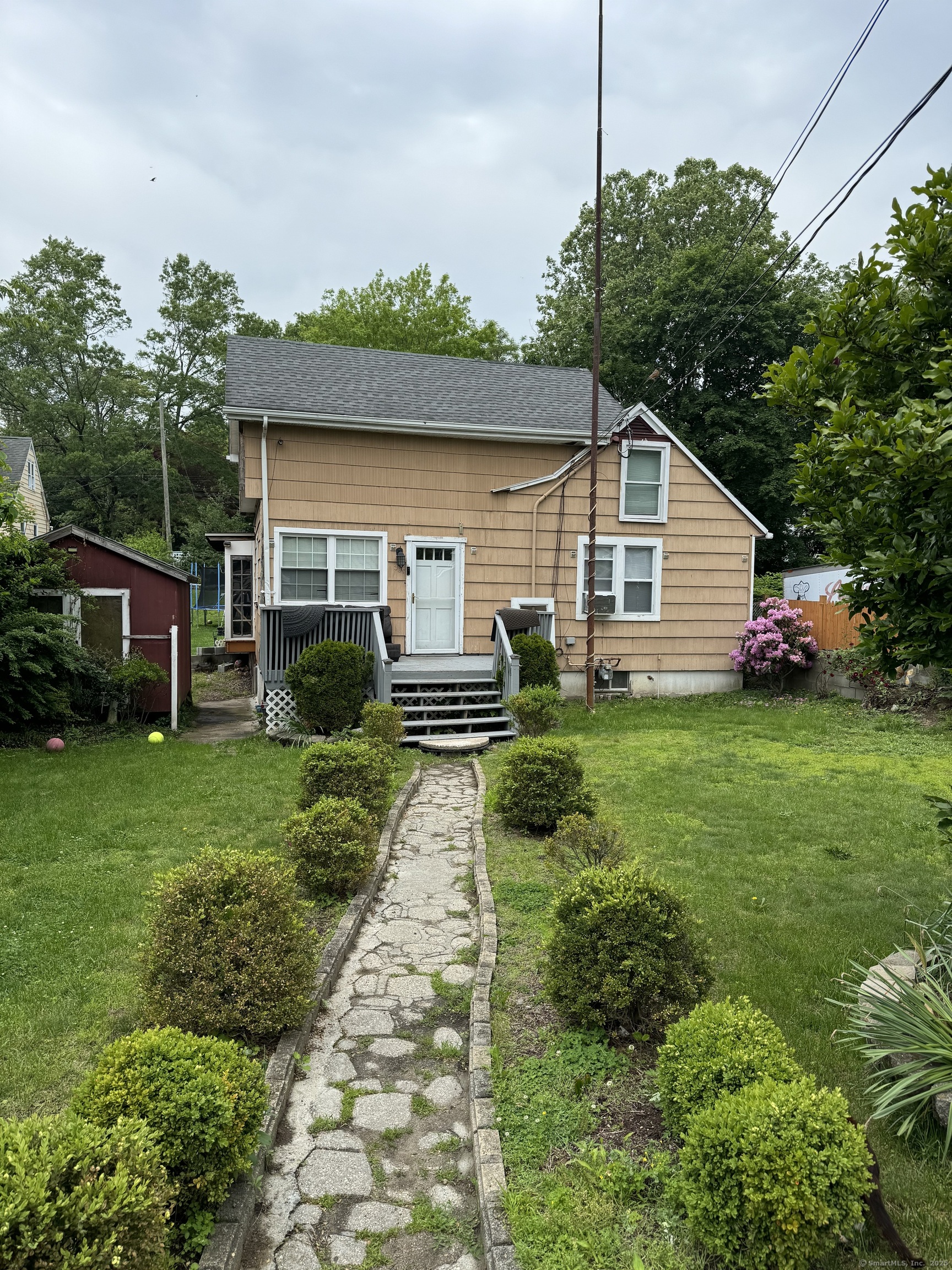 a house view with a garden space
