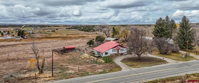 a view of a swimming pool with a yard