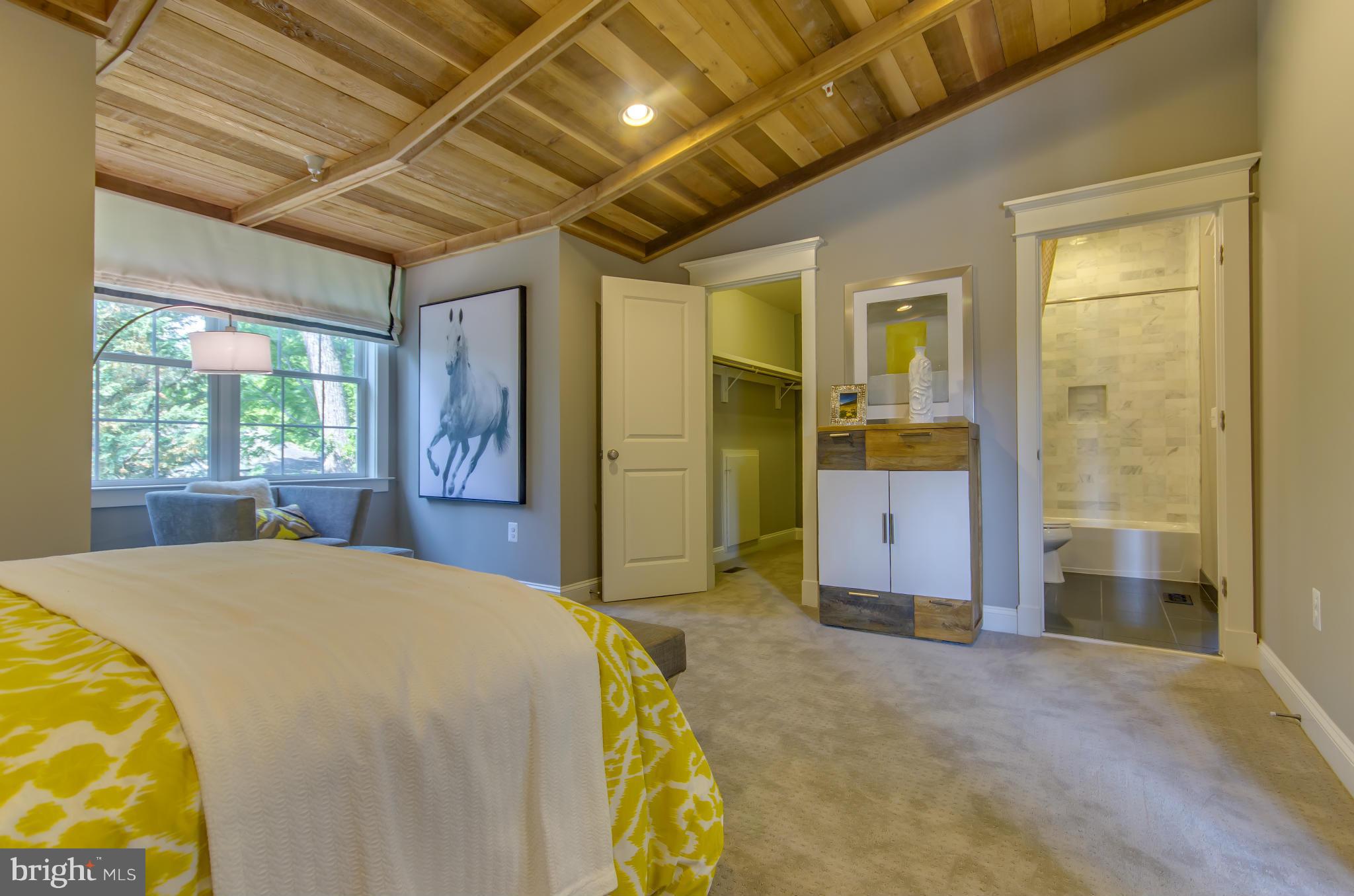 8106 Old Georgetown Road Bethesda, MD 20814 - Photo 22 of 30 a bedroom with a bed and a view of bathroom