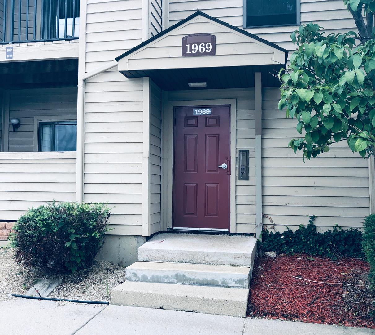 1969 North Hicks Road, Unit 102 Palatine, IL 60074 - Photo 1 of 17 a view of entrance gate of the house