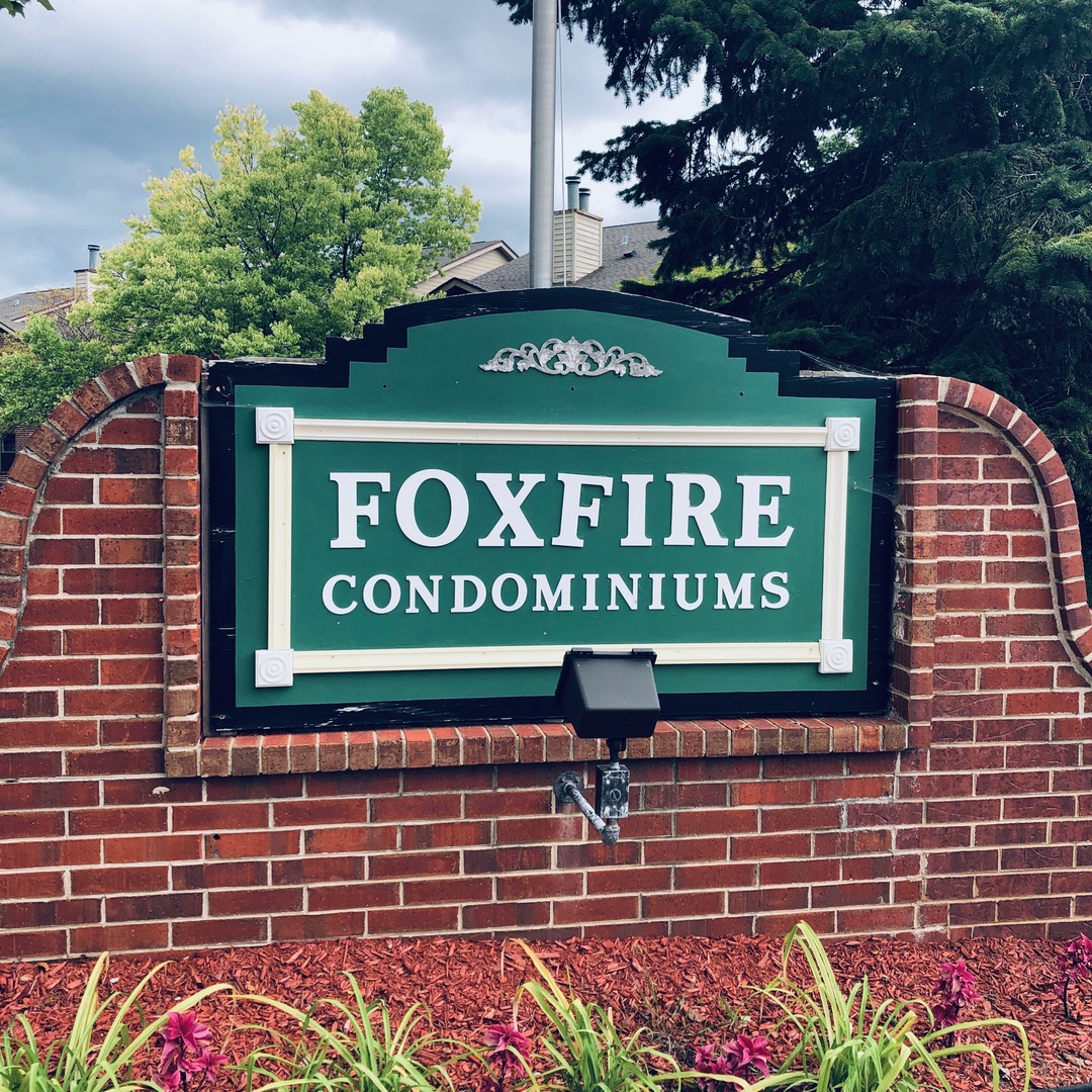 1969 North Hicks Road, Unit 102 Palatine, IL 60074 - Photo 2 of 17 a sign on the brick wall