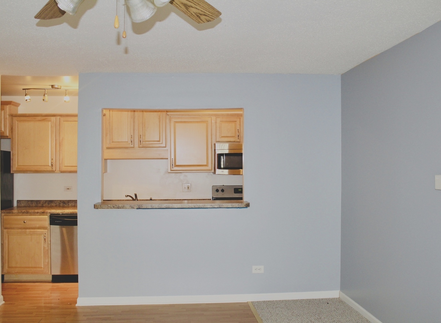 1969 North Hicks Road, Unit 102 Palatine, IL 60074 - Photo 7 of 17 a bathroom with a granite countertop sink and a mirror