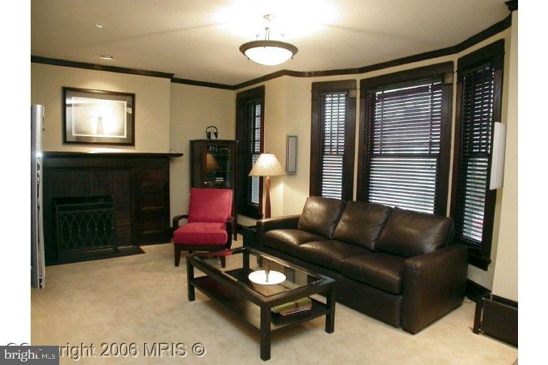 1905 16th Street Northwest Washington, DC 20009 - Photo 5 of 9 a living room with furniture and a fireplace