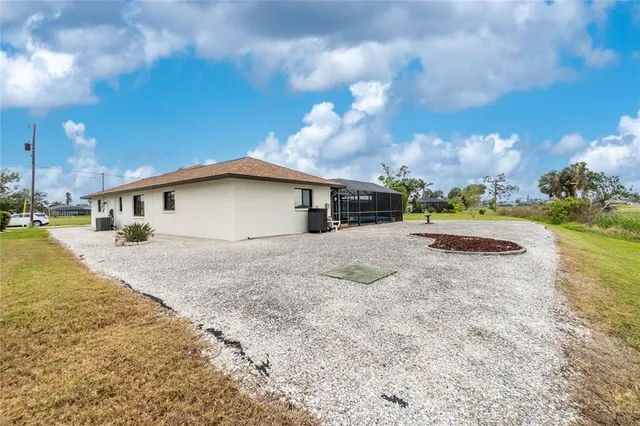 an aerial view of a houses with outdoor space