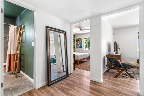 a view of a livingroom from dining room and wooden floor