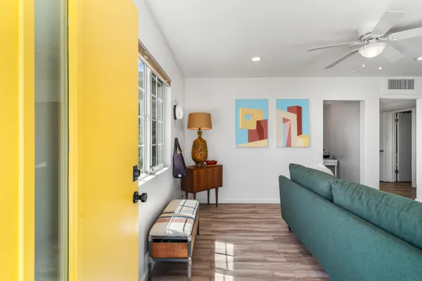 a living room with furniture and a table