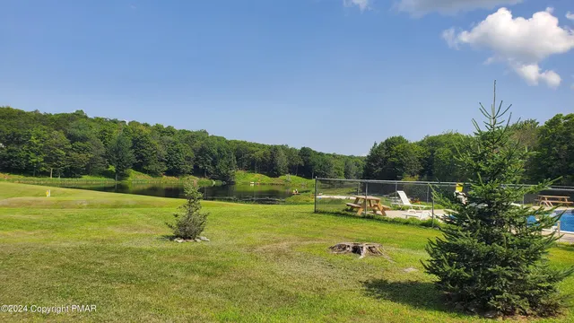 a view of a lake with a yard