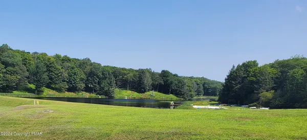 a view of a golf course with a lake