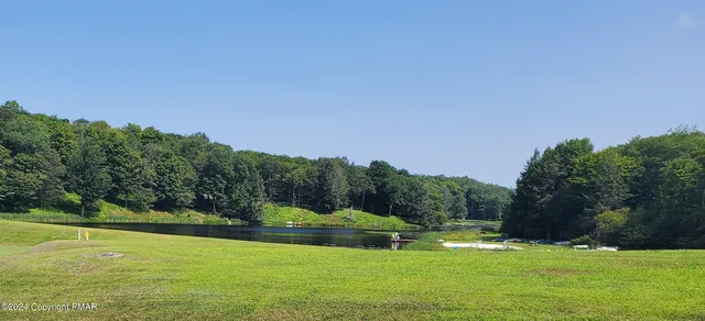 a view of a golf course with a lake
