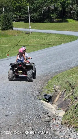 a view of a park with a car parked