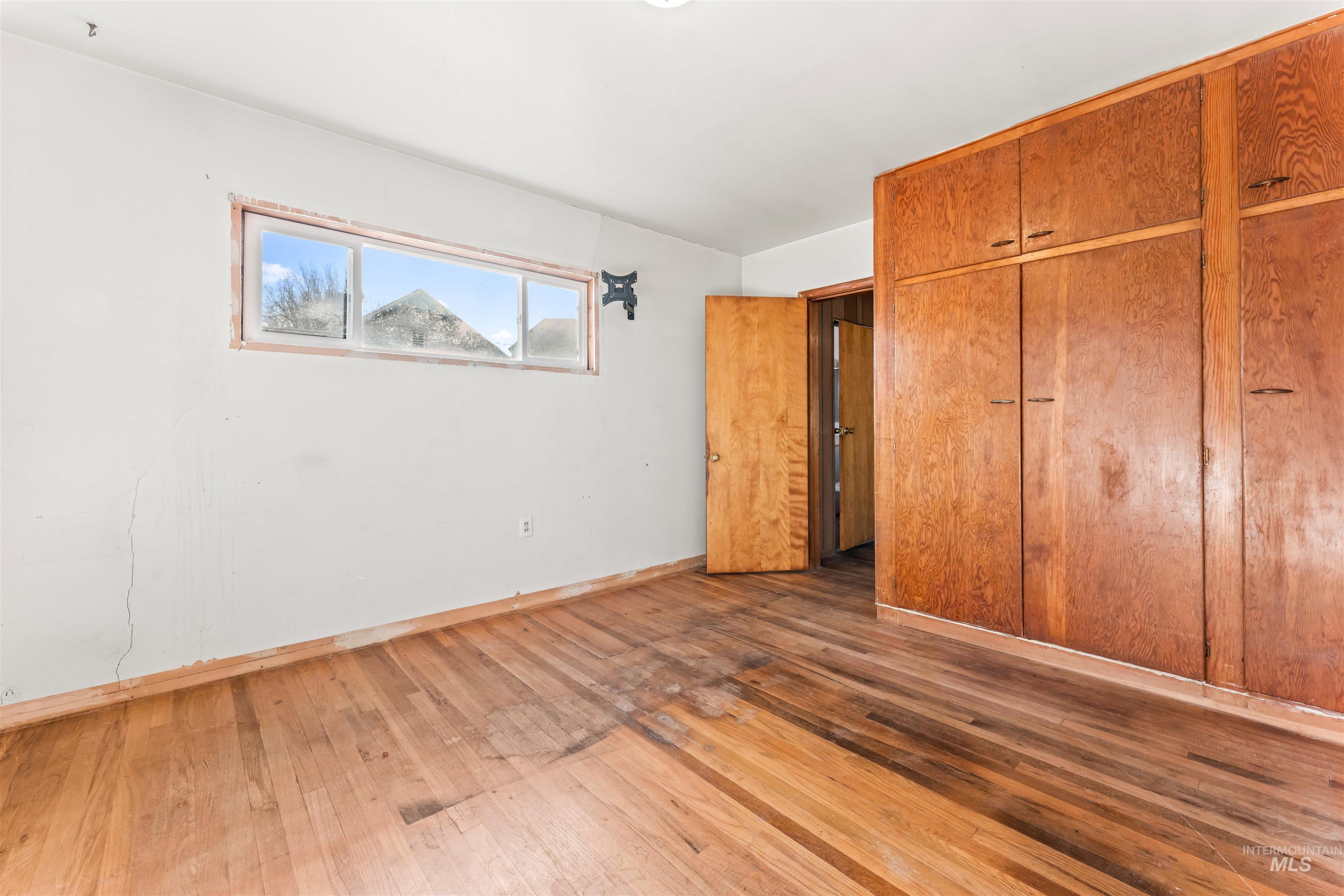 1115 Airbase Road Mountain Home, ID 83647 - Photo 30 of 32 Unfurnished bedroom with a closet and hardwood / wood-style floors
