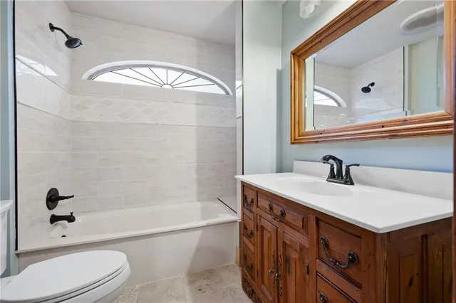 a view of a yard with wooden fence