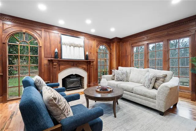 a kitchen with stainless steel appliances granite countertop a sink and wooden cabinets
