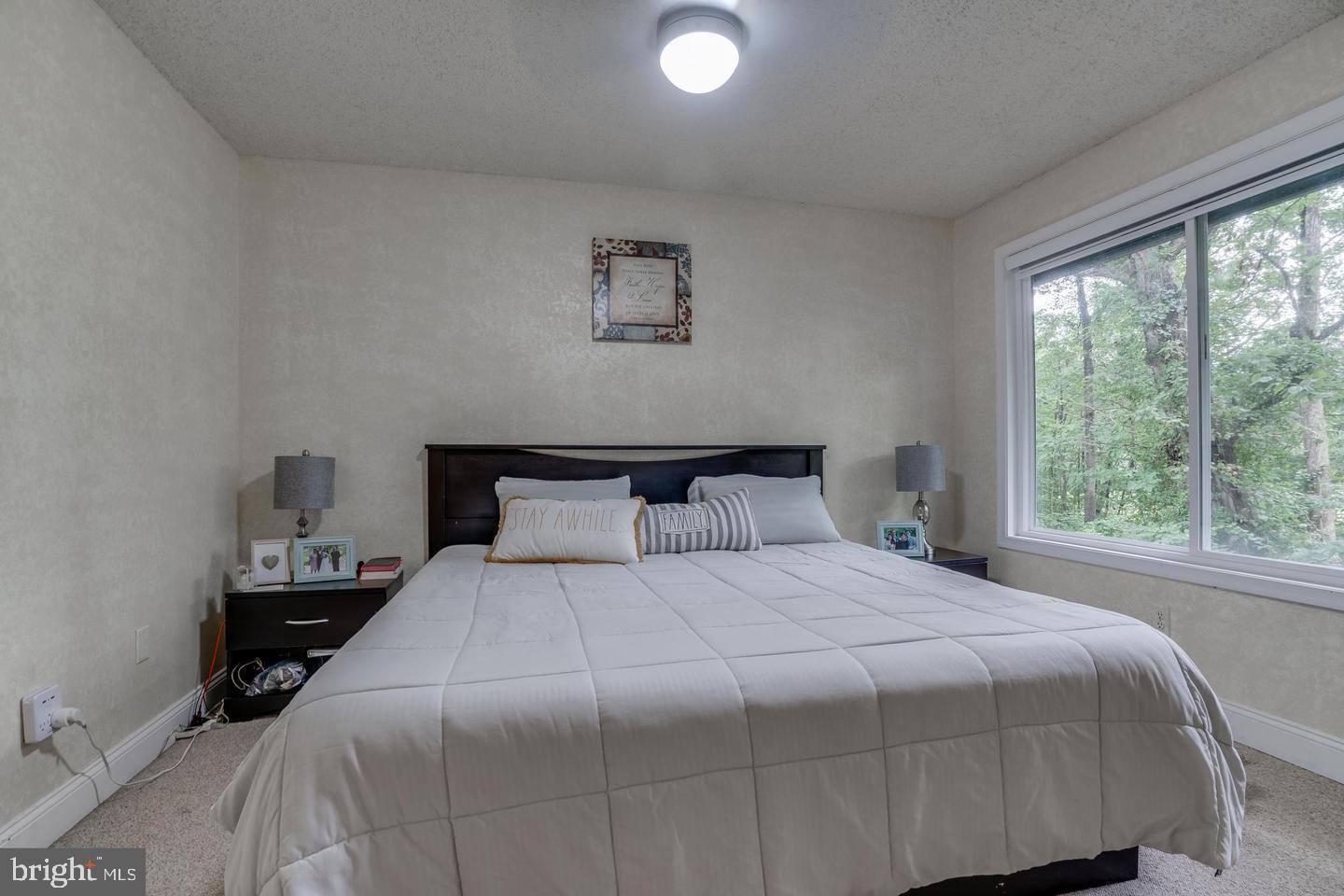 2132 Cartwright Place Reston, VA 20191 - Photo 15 of 21 a bedroom with a bed and window