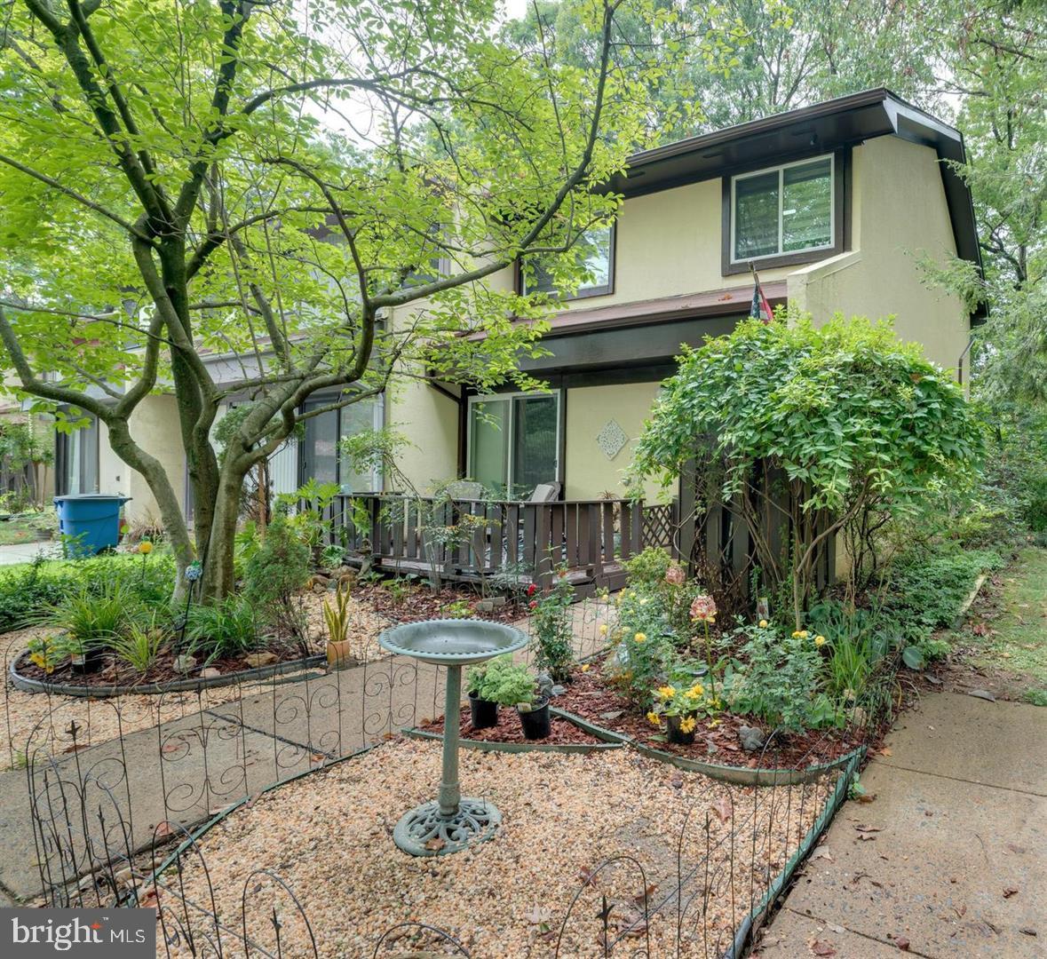 2132 Cartwright Place Reston, VA 20191 - Photo 2 of 21 a front view of a house with garden