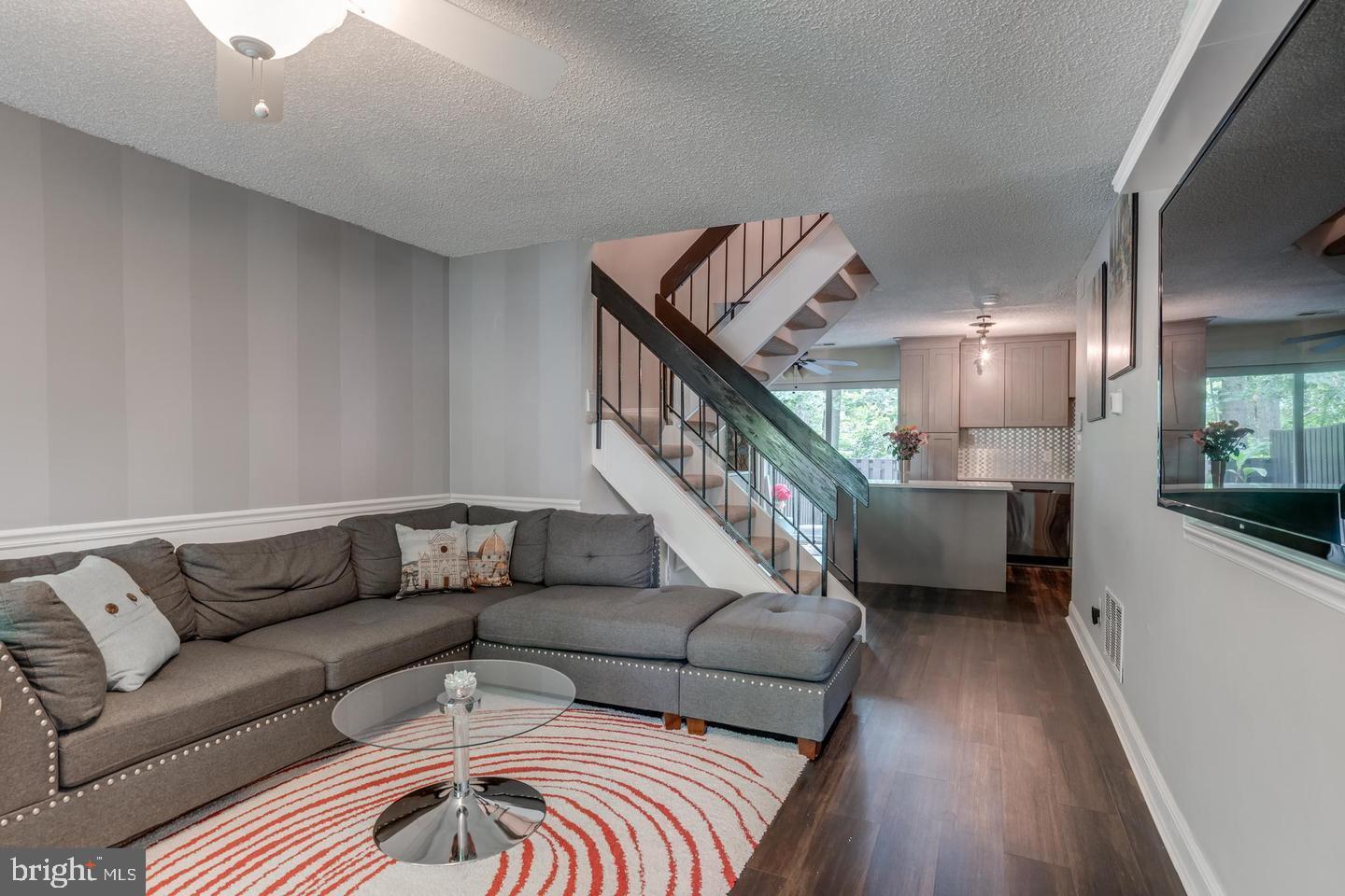 2132 Cartwright Place Reston, VA 20191 - Photo 3 of 21 a living room with furniture and a rug