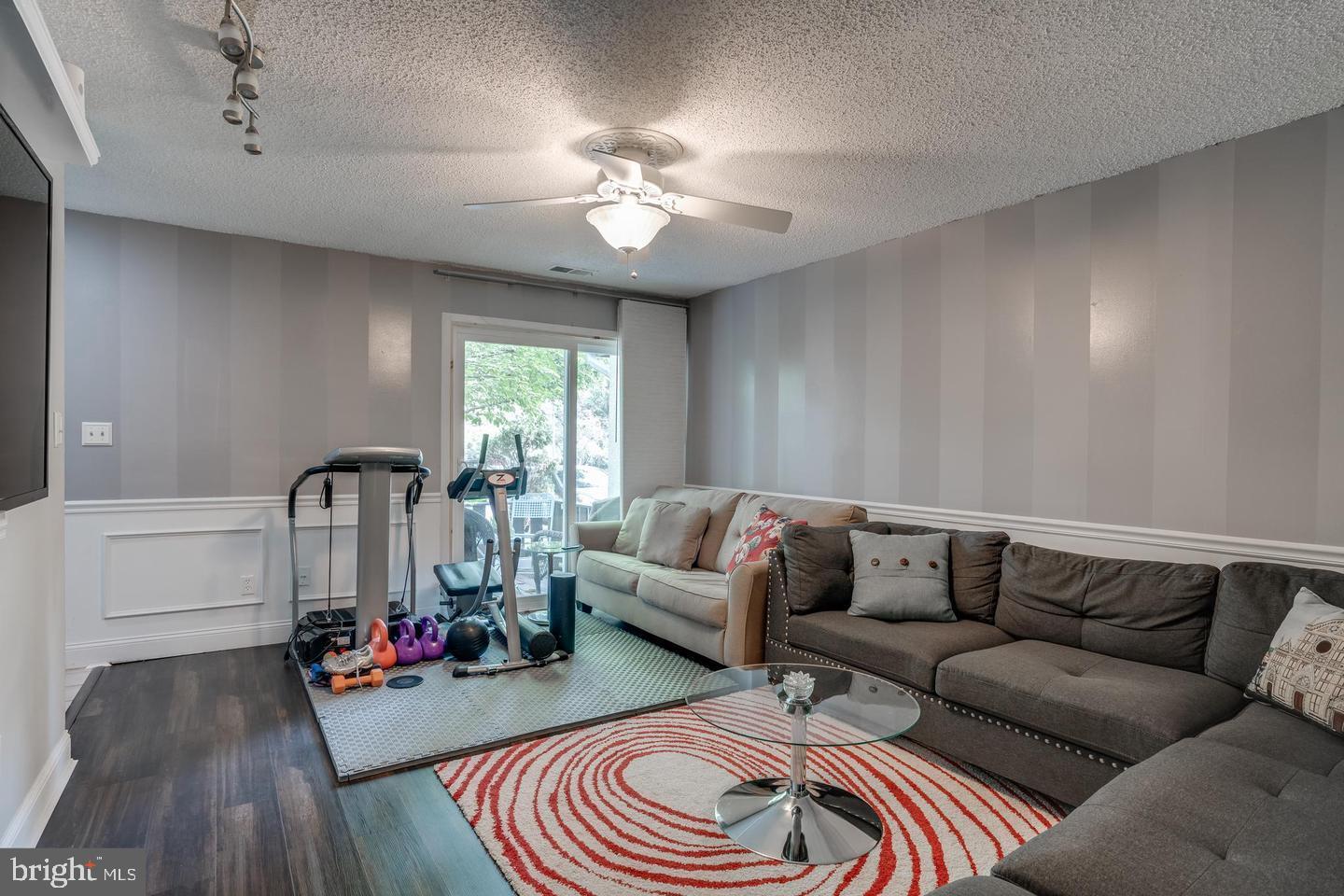 2132 Cartwright Place Reston, VA 20191 - Photo 5 of 21 a living room with furniture and wooden floor