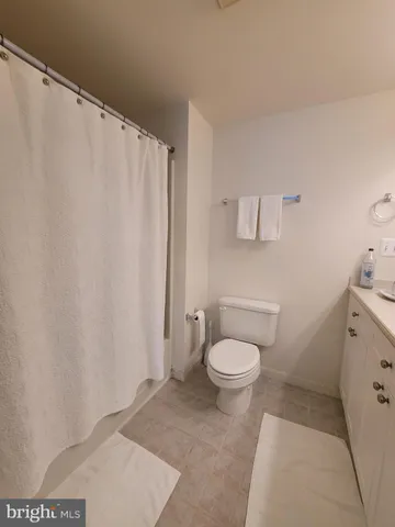 a bedroom with a bed and a walk in closet