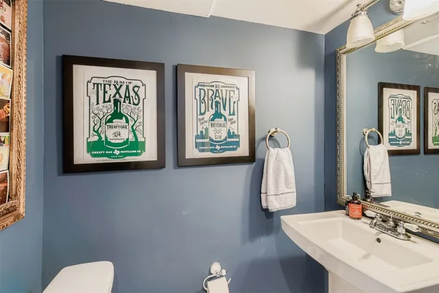 a bathroom with 2 sink and a mirror