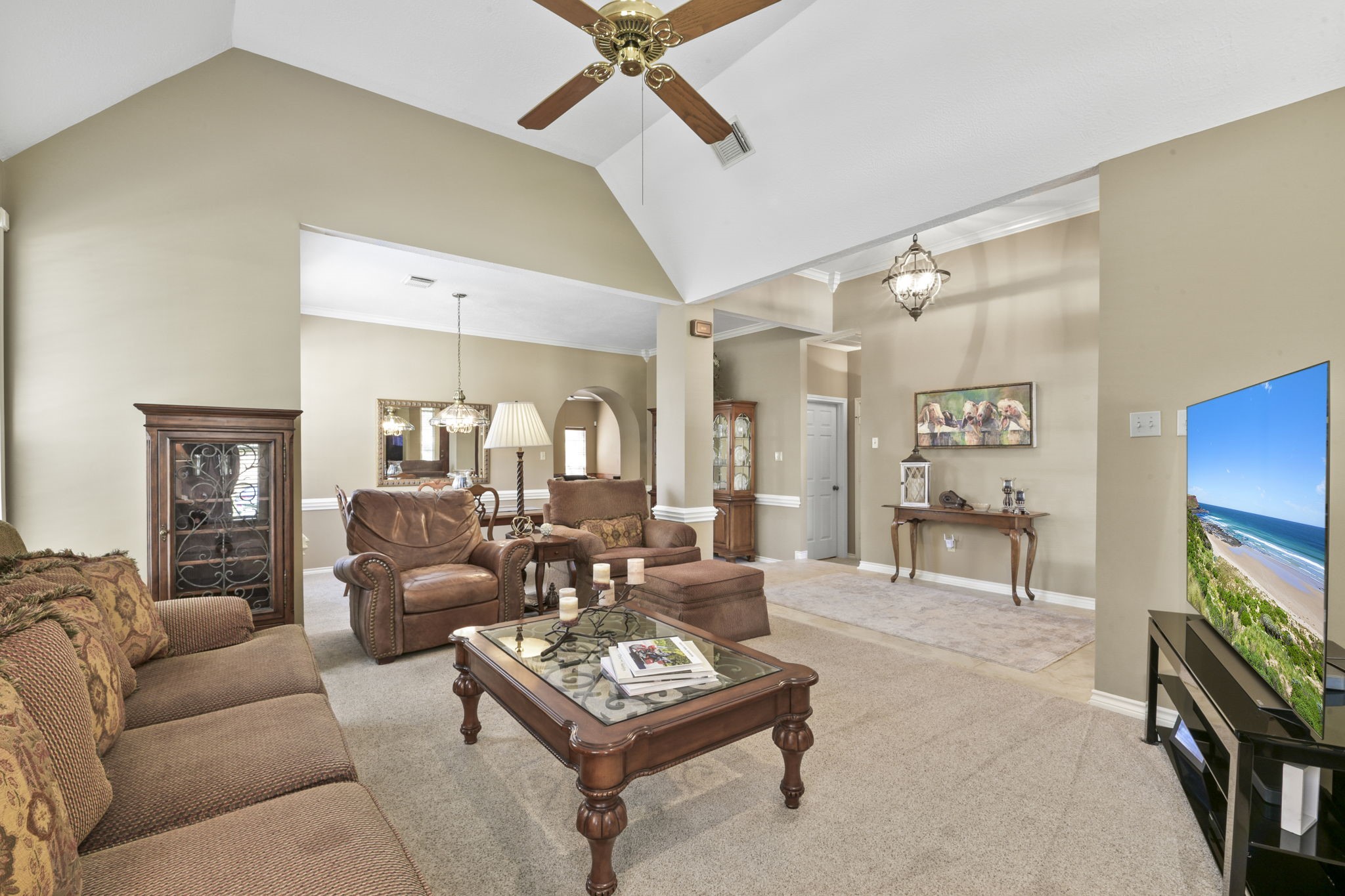 5827 Ashmere Lane Spring, TX 77379 - Photo 12 of 50 a living room with furniture a table and a flat screen tv