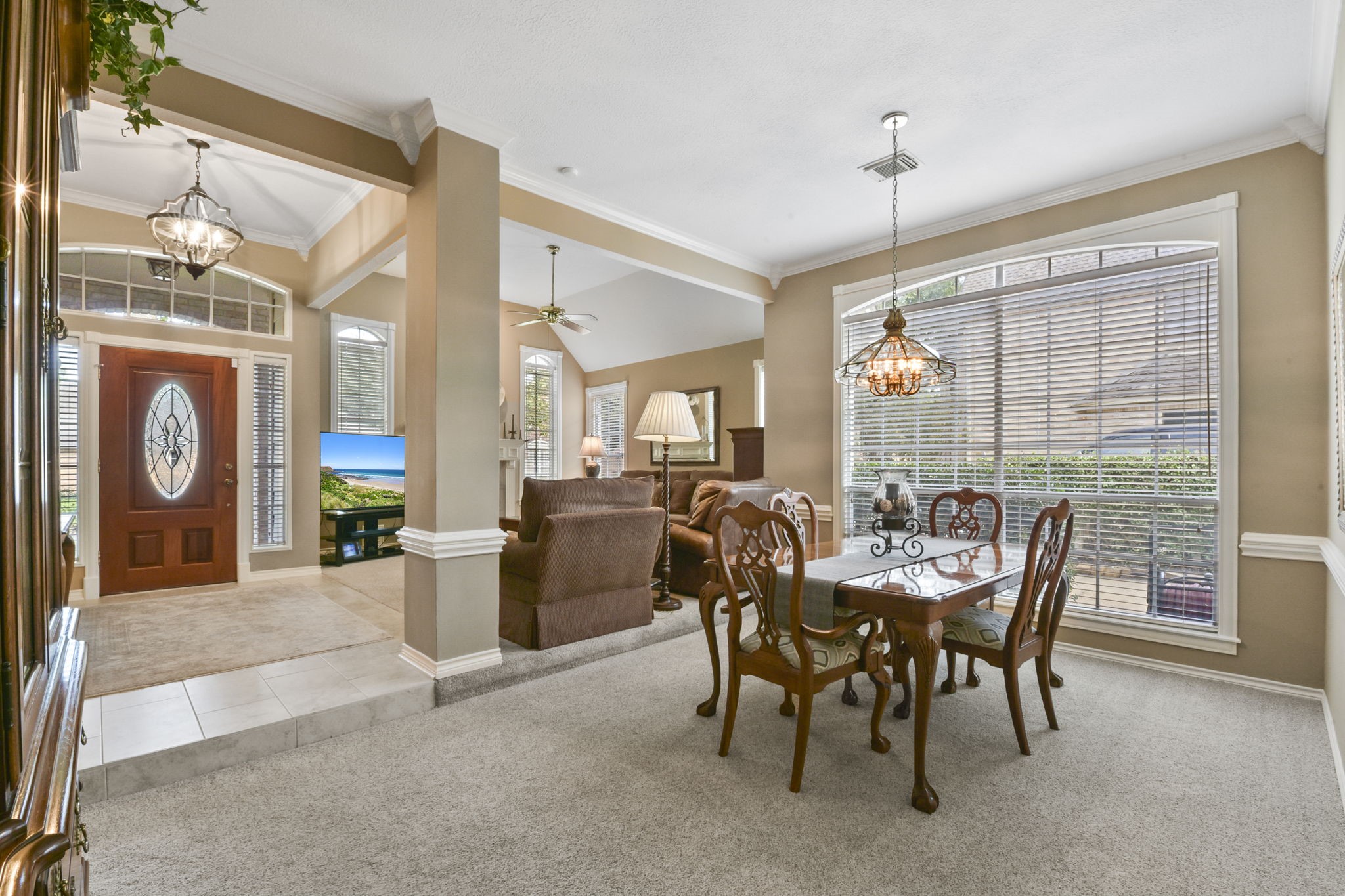 5827 Ashmere Lane Spring, TX 77379 - Photo 15 of 50 a view of a dining room and livingroom with furniture wooden floor a chandelier