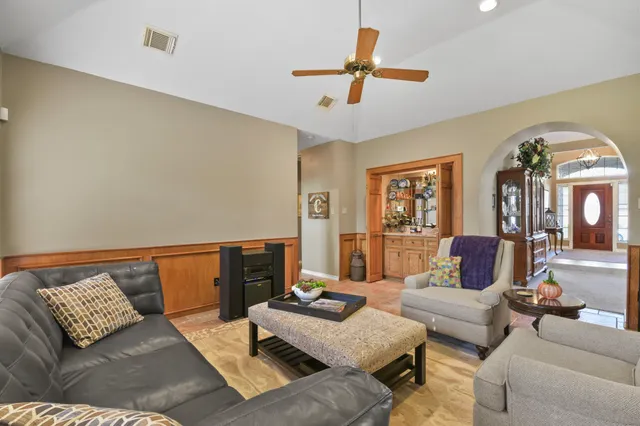 a living room with furniture and a couch