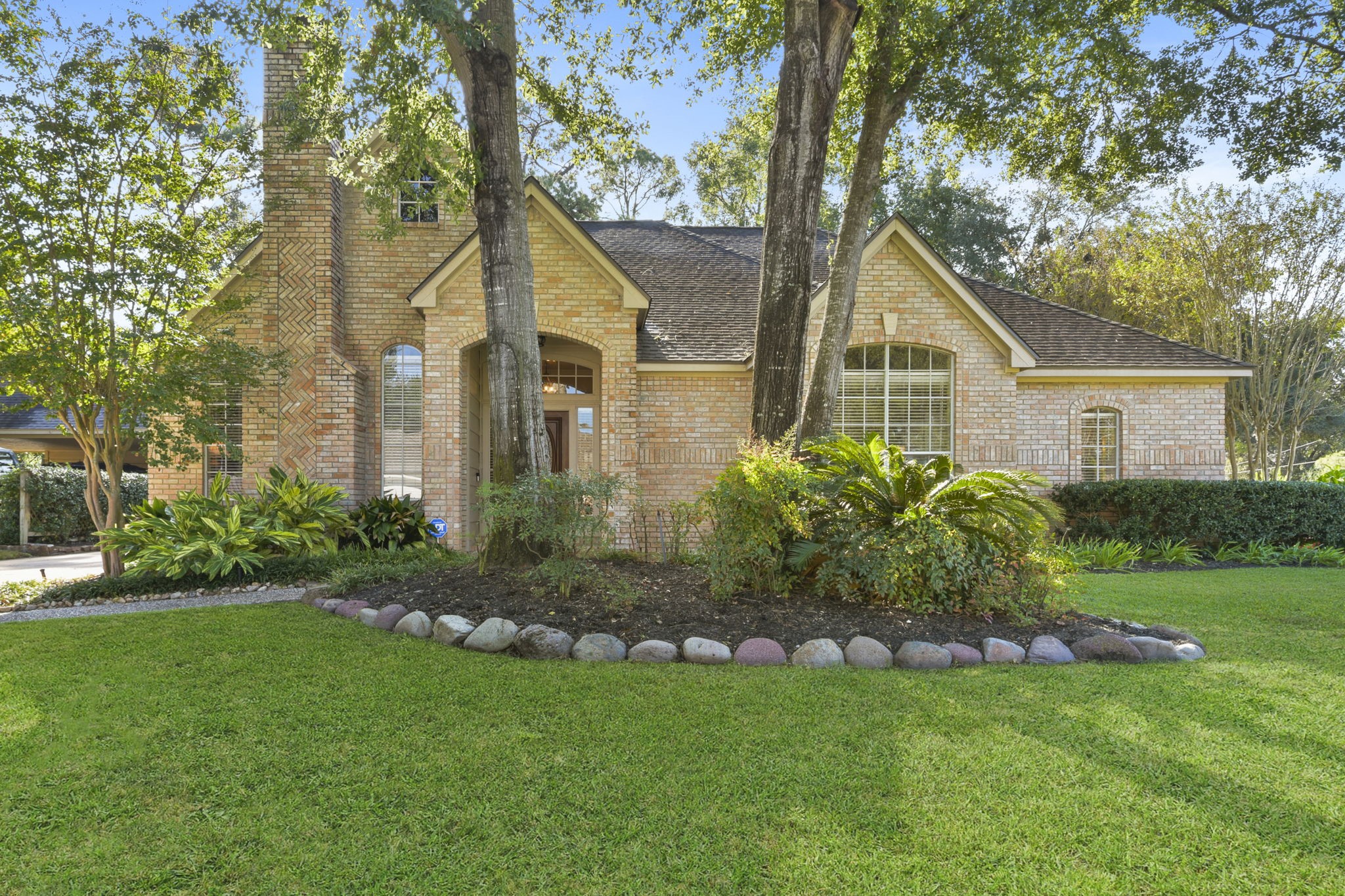 5827 Ashmere Lane Spring, TX 77379 - Photo 2 of 50 a front view of house with yard and green space