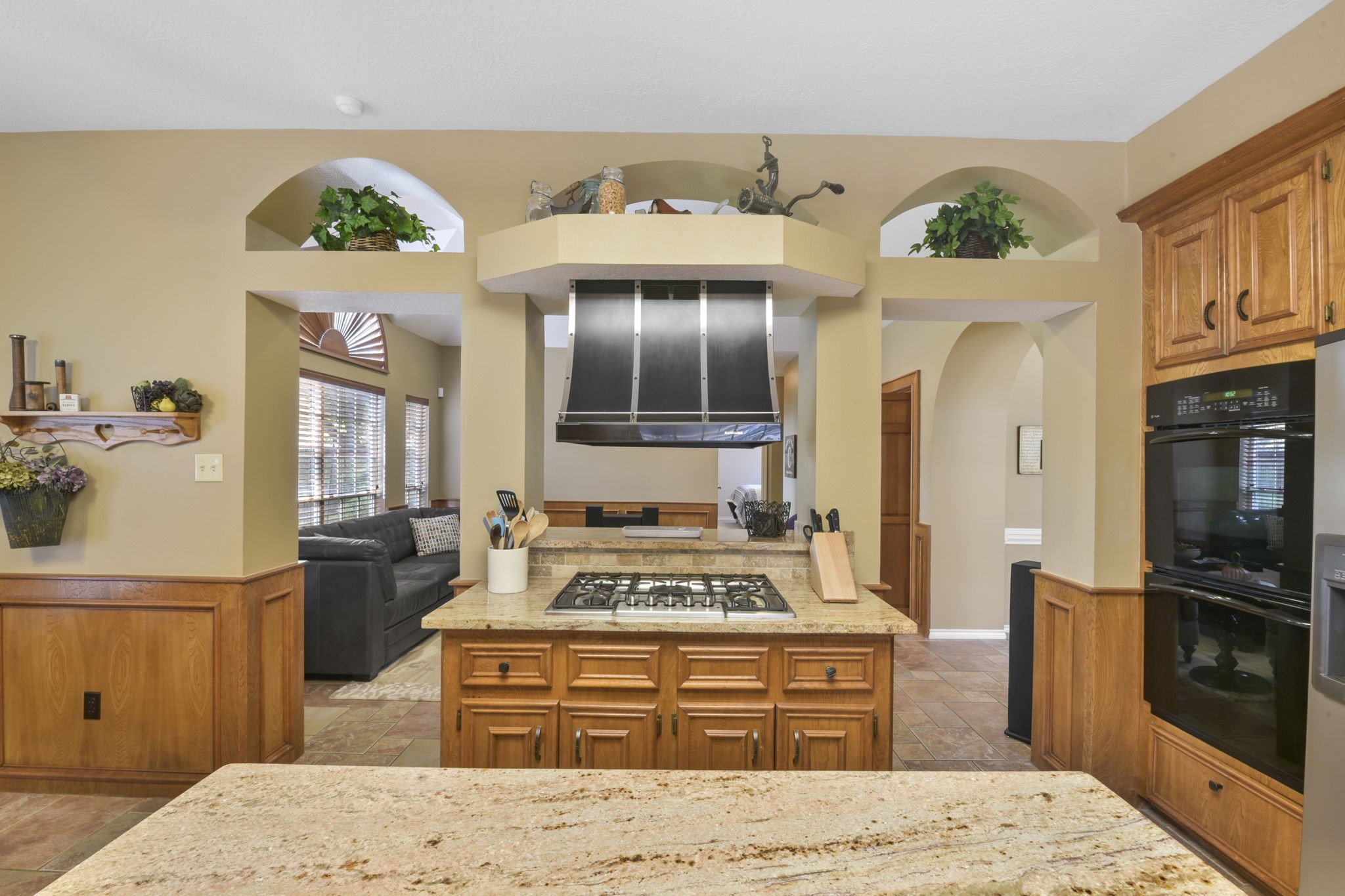5827 Ashmere Lane Spring, TX 77379 - Photo 25 of 50 a living room with stainless steel appliances kitchen island granite countertop a stove and a refrigerator
