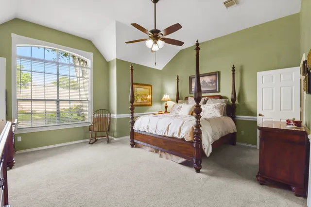 a bed room with a bed and a window