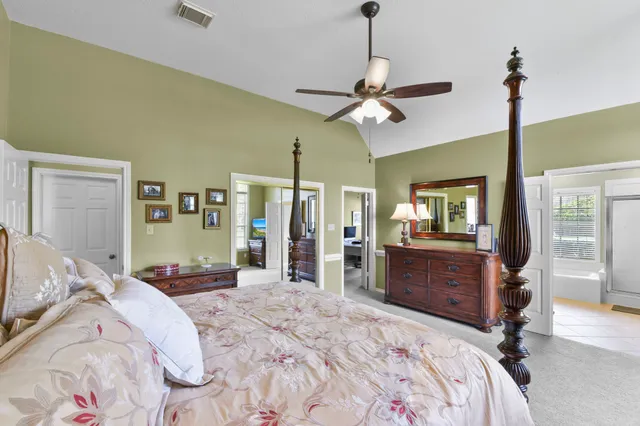 a bed room with a bed and dresser