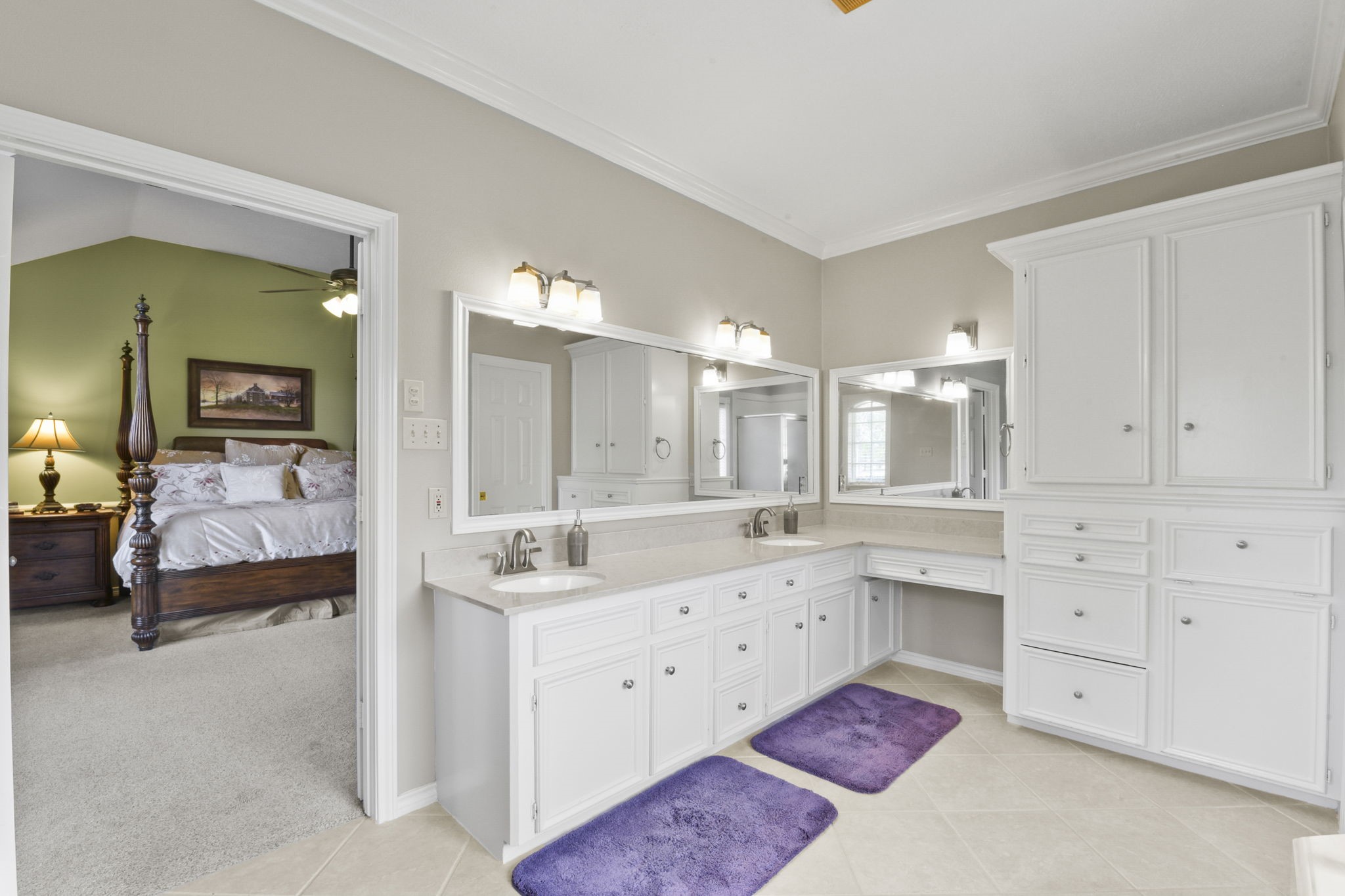 5827 Ashmere Lane Spring, TX 77379 - Photo 34 of 50 a en suite bathroom with a double vanity sink a large mirror and a bathtub