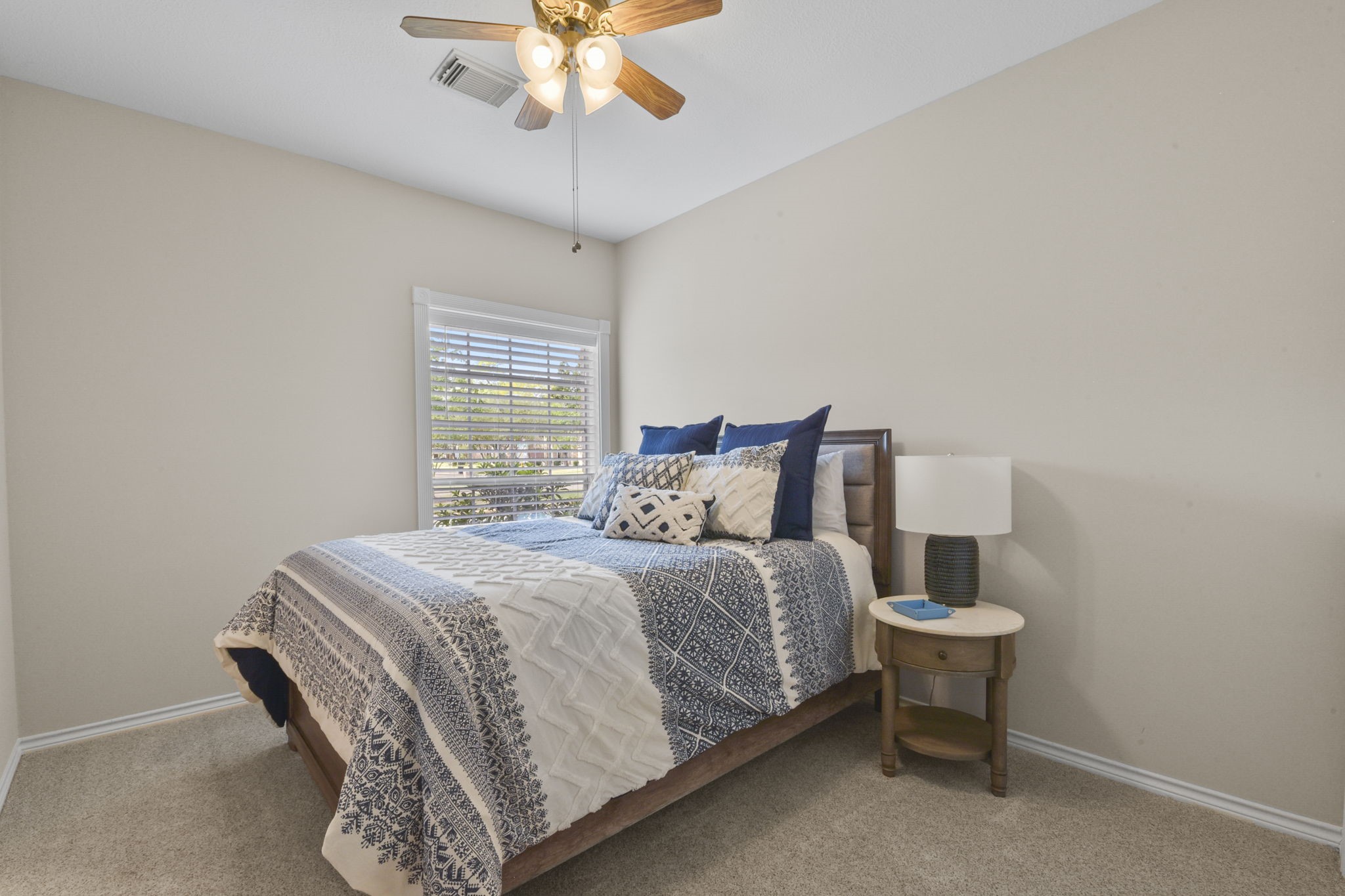 5827 Ashmere Lane Spring, TX 77379 - Photo 40 of 50 a bedroom with a bed and a chandelier