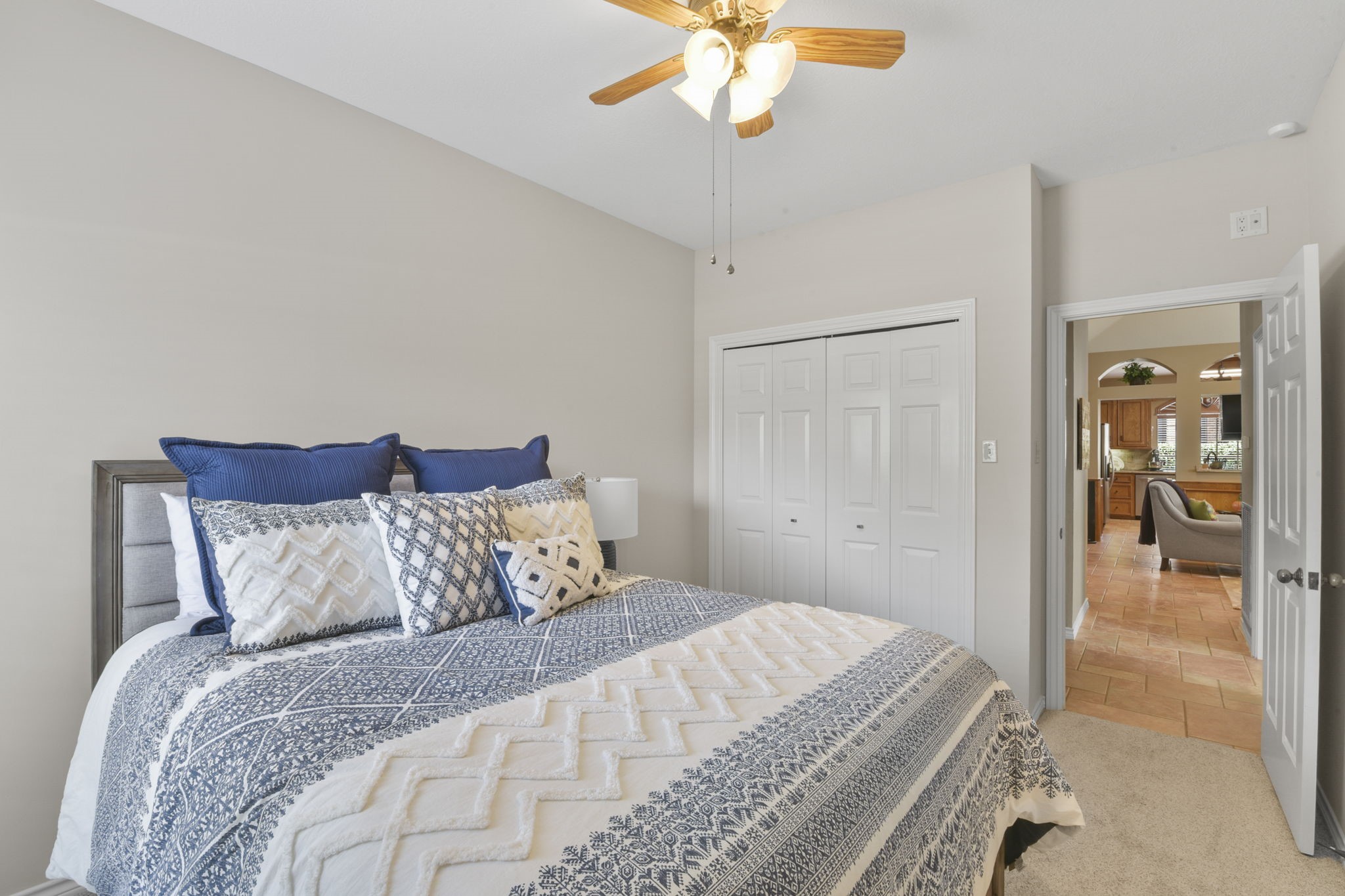 5827 Ashmere Lane Spring, TX 77379 - Photo 41 of 50 a bedroom with a large bed and a chandelier