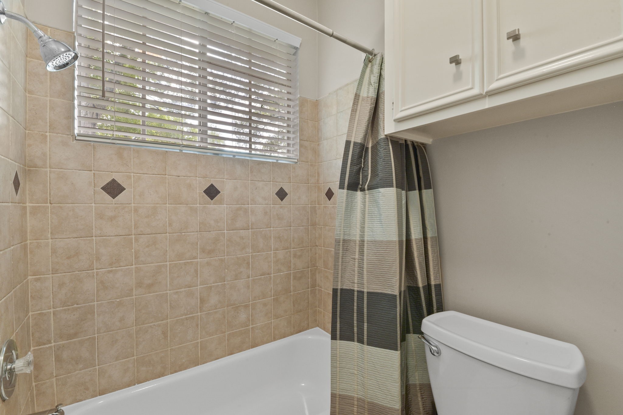 5827 Ashmere Lane Spring, TX 77379 - Photo 43 of 50 a bathroom with a toilet and a shower