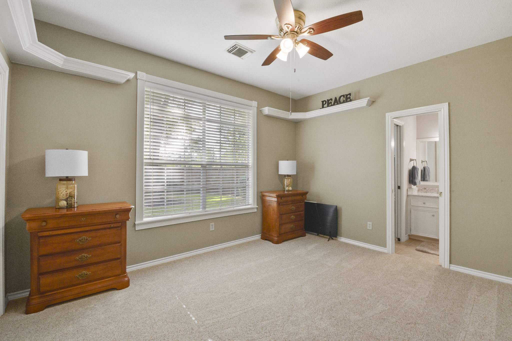 5827 Ashmere Lane Spring, TX 77379 - Photo 44 of 50 a view of workspace with cabinet and a ceiling fan