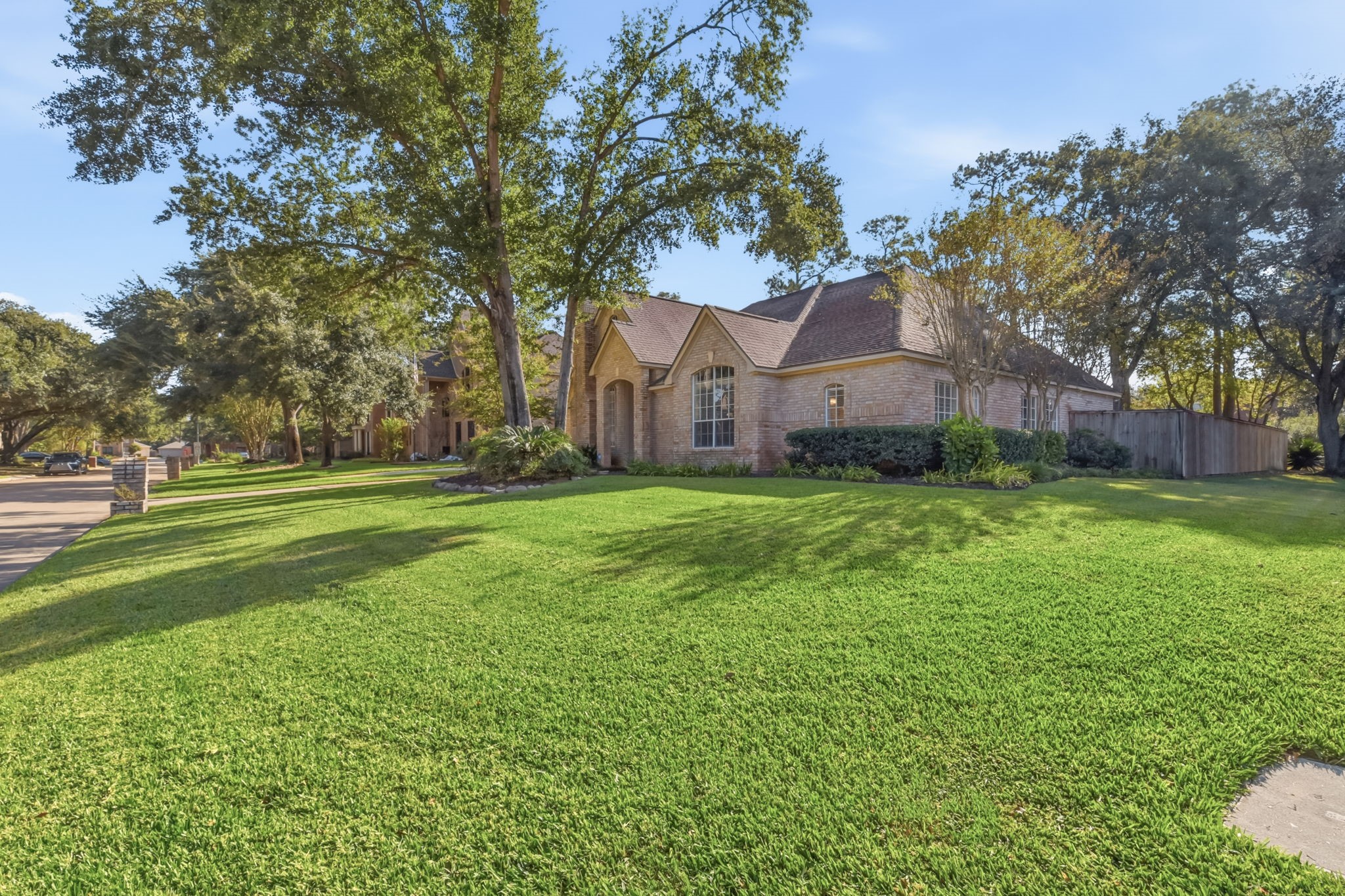 5827 Ashmere Lane Spring, TX 77379 - Photo 5 of 50 a view of a big yard next to a large tree