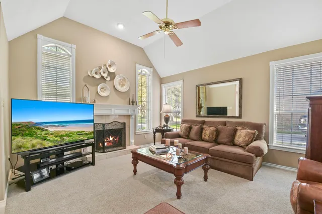 a living room with furniture and a fireplace