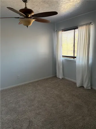a bathroom with a shower and toilet