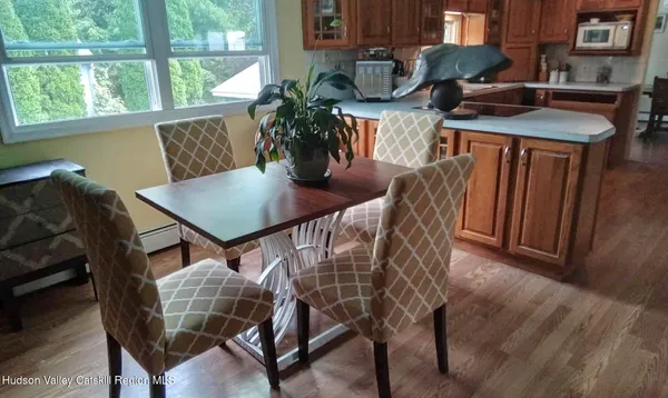 a view of a dining room with furniture and window
