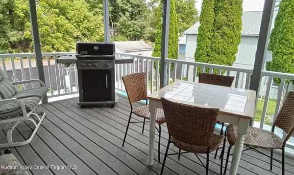 a view of a balcony with chairs