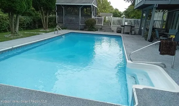 a view of a balcony with chairs